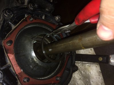 The snap rings can be a frustrating and painful things. If things dont go well walk away for a few minutes! I also feel propping up the axle to keep it level helps.