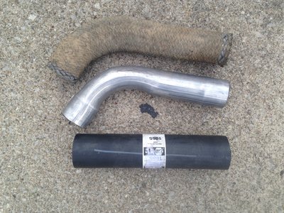 Raw materials. Old filler tube for pattern. New gas filler tube Napa 1055. Custom bent steel tubing